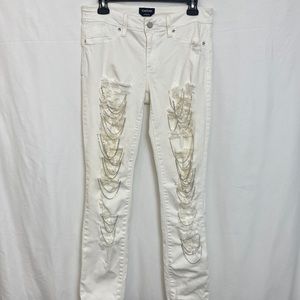 Bebe Women’s white jeans distressed in size 30.
